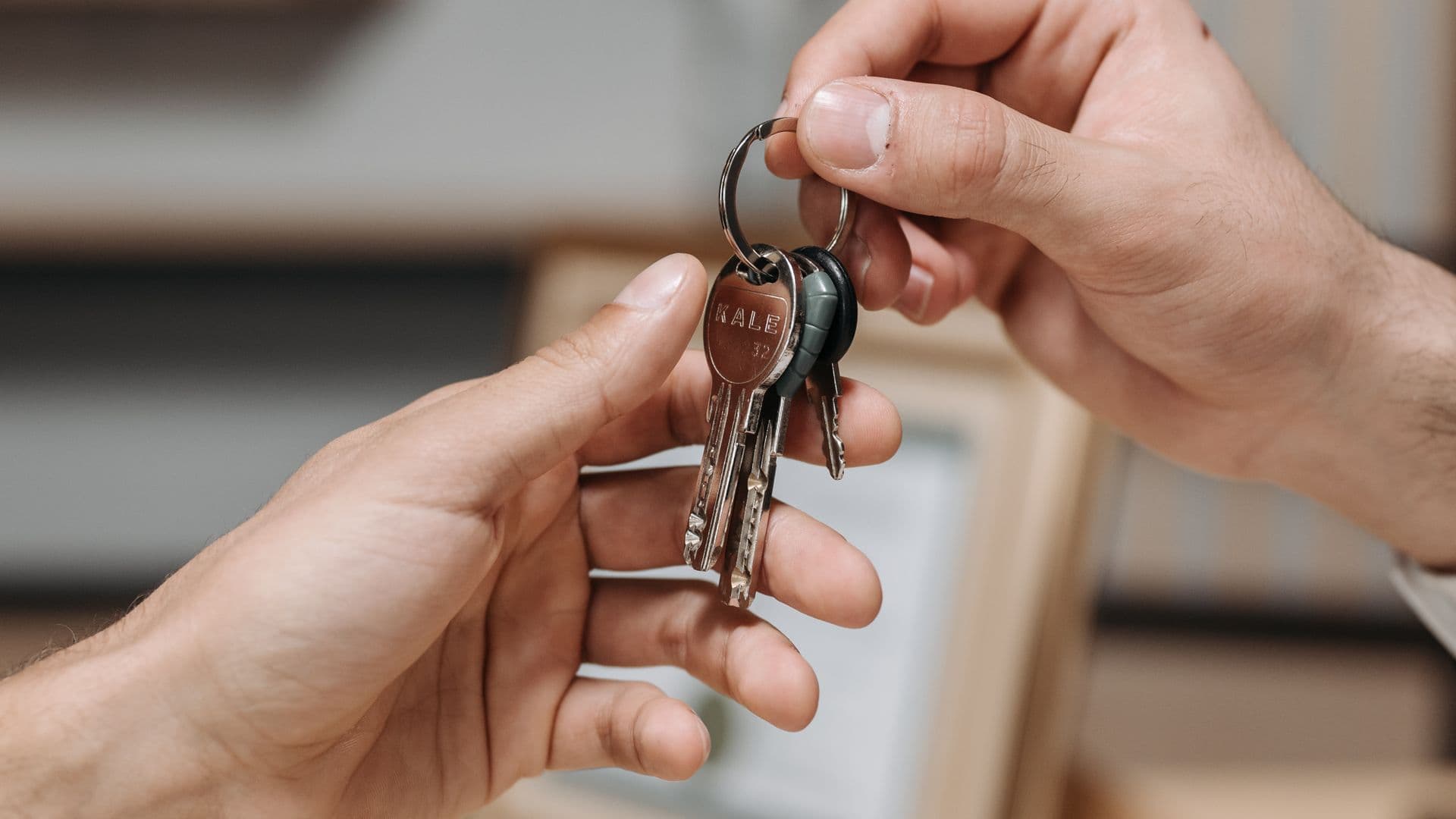 One set of keys passing from one hand to another