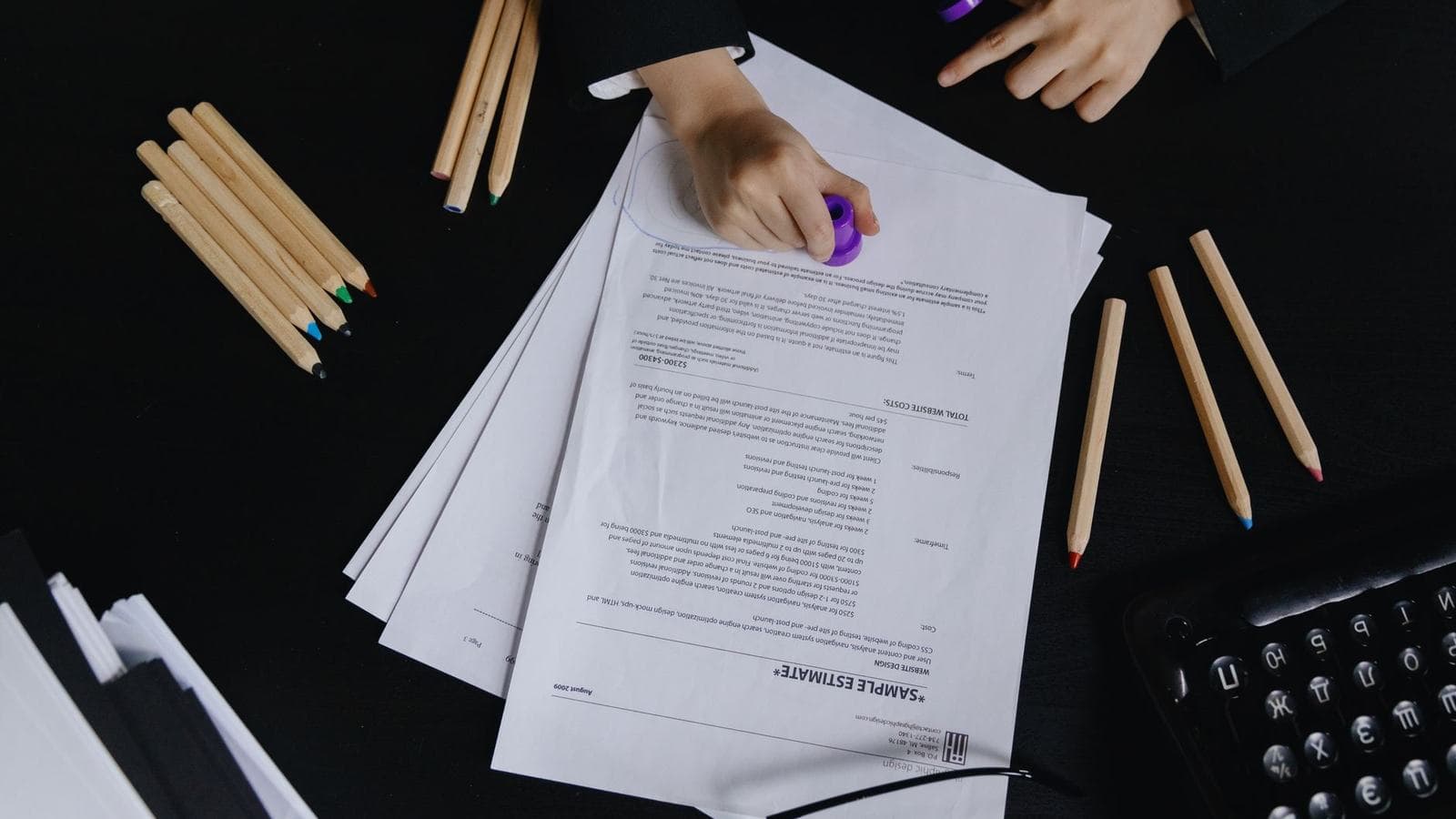 Hands stamping an official property document