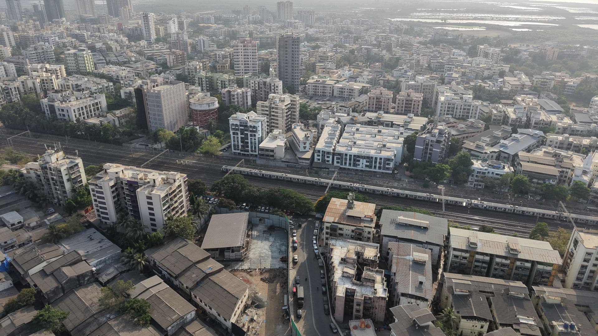 Mumbai from above, dense residential blocks under daylight