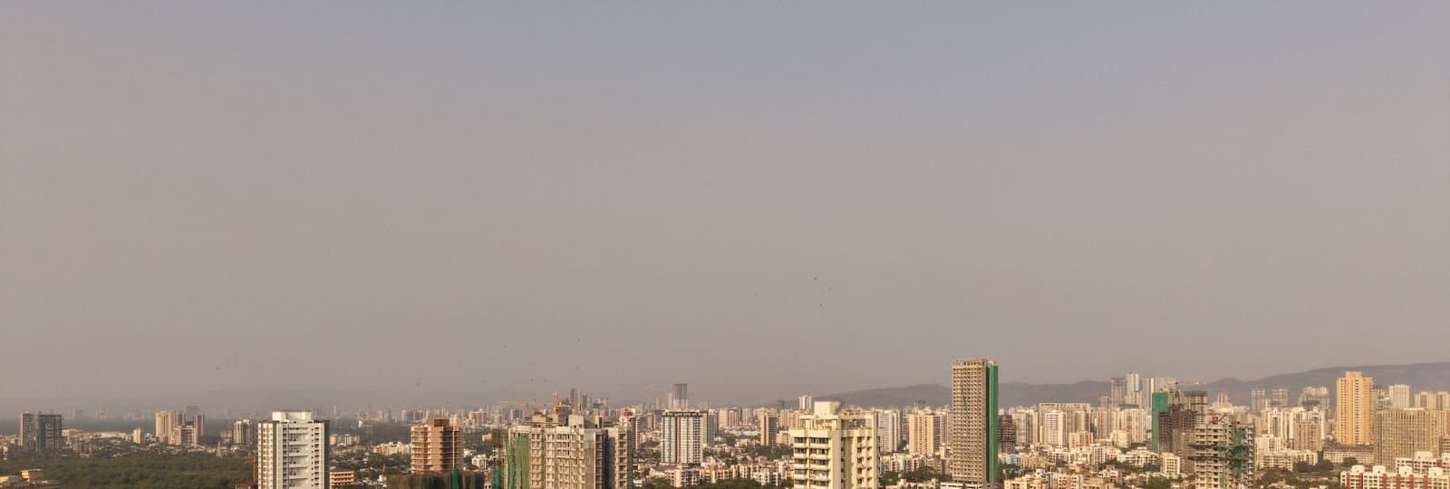 The towers of Mumbai's western suburbs in warm evening light