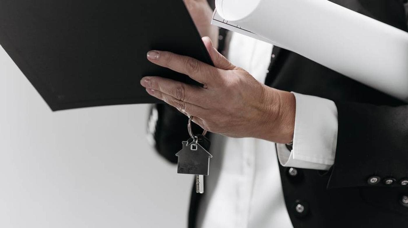 Keys and building plans on a desk