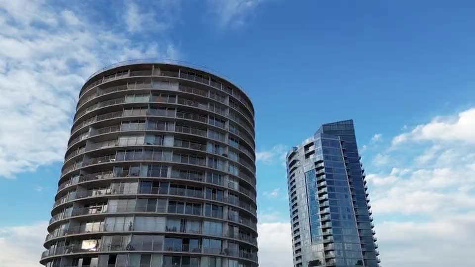 The Hiranandani towers in Mumbai above a belt of mature trees and Powai lake